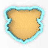 a cookie cutter shaped like a shield