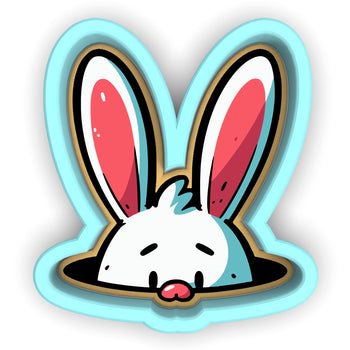 a sticker of a rabbit sticking its head out of a hole