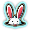 a sticker of a rabbit sticking its head out of a hole
