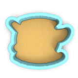 a cookie cutter with a cookie in the shape of a bear