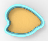 A blue-bordered cookie cutter with a yellow-colored interior, designed for cutting out cookies.