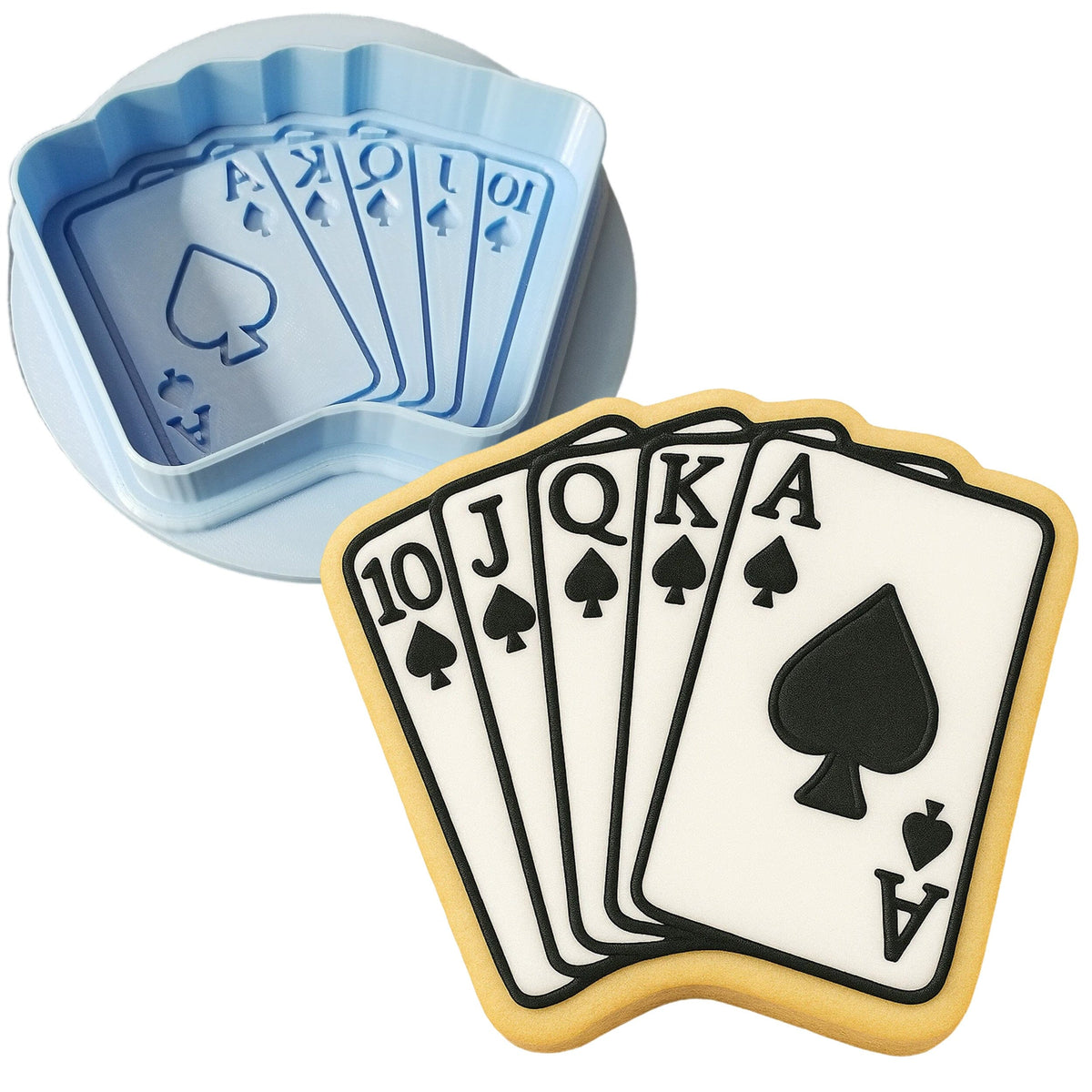 a cookie shaped like a playing card and a cookie cutter