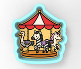a picture of a carousel with horses on it