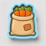 A cartoon image of a bag filled with three carrots.