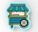 a blue and yellow cart with a canopy on top