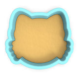a cookie cutter with a cookie in the shape of a cat