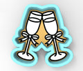 a pair of champagne glasses with bows on them