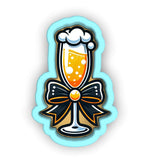 a glass of beer with a bow around it