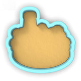 a cookie cutter with a cookie in the shape of a hand