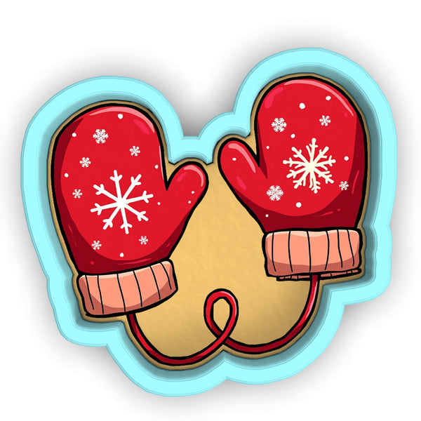 a pair of red gloves with snowflakes on them