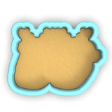 a cookie shaped like a bear on a white background