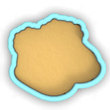 a cookie cutter with a cookie in the shape of a cookie