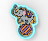 a picture of an elephant on top of a ball