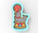 a picture of a seal with a balloon in its mouth