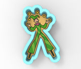 a paper cut out of a person wearing a green outfit