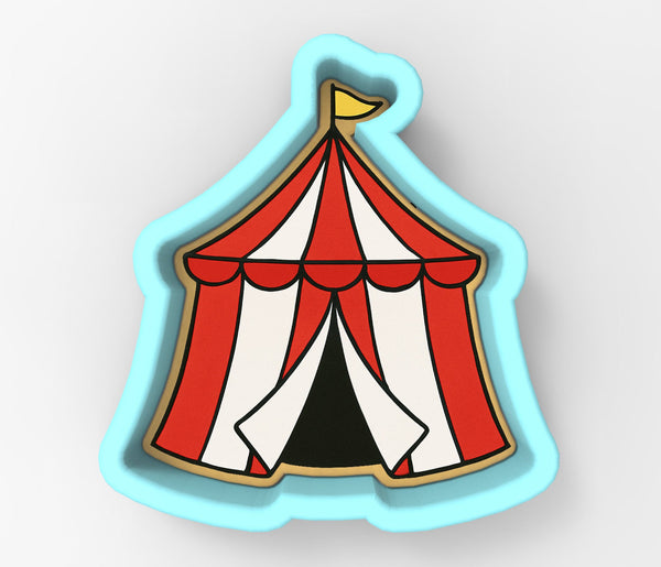 a red and white circus tent sitting on top of a white wall