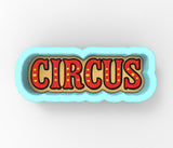 a close up of a button with the word circus on it