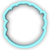 a cookie cutter shaped like a scallop