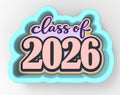 a large, colorful, and stylized "Class of 2026" cookie cutter.