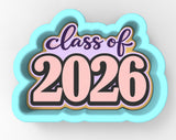 a large, colorful, and stylized "Class of 2026" cookie cutter.