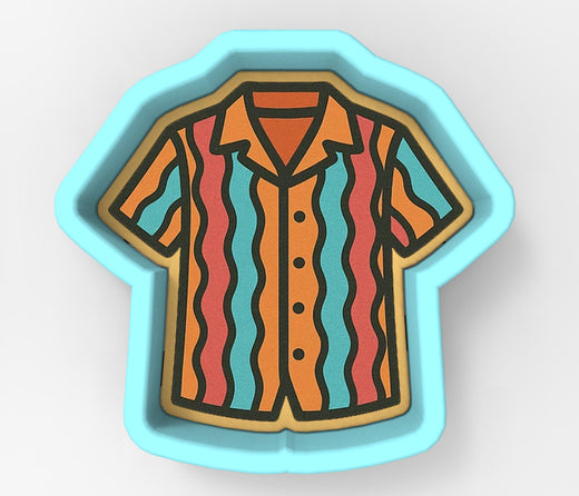 A cookie cutter in the shape of a colorful striped shirt.