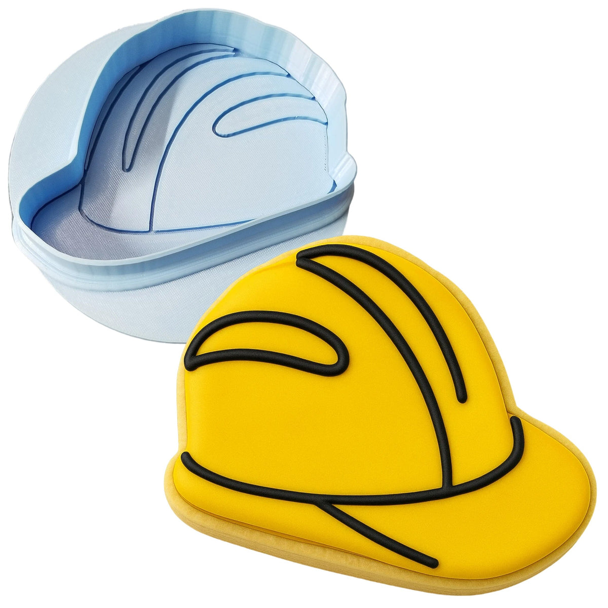a cookie shaped like a hard hat next to a cookie cutter