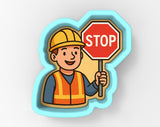 A cartoon construction worker holding a stop sign.