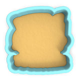 a cookie cutter with a cookie in the shape of a square