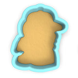 a cookie cutter with a cookie in the shape of a head