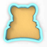 a cookie shaped like a teddy bear on a white background