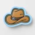 A cowboy hat cookie cutter in the shape of a cloud, with a star symbol on the front.