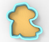 A 3D rendering of a cookie cutter in the shape of a dog's head, with a light yellow body and a blue outline.