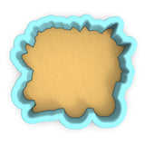 a cookie cutter with a cookie in the shape of a sheep