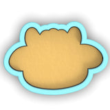 a cookie shaped like a teddy bear on a white background