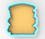 A cookie cutter in the shape of a heart, with a light yellow background.