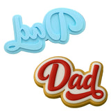 a cookie with the word dad spelled in red and white