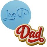 a cookie with the word dad written on it