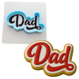 a cookie with the word dad on it next to a cookie with the word dad