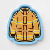 A cookie cutter in the shape of a fireman's uniform, with yellow and gray stripes.