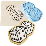 a cookie with two dices and a cookie cutter
