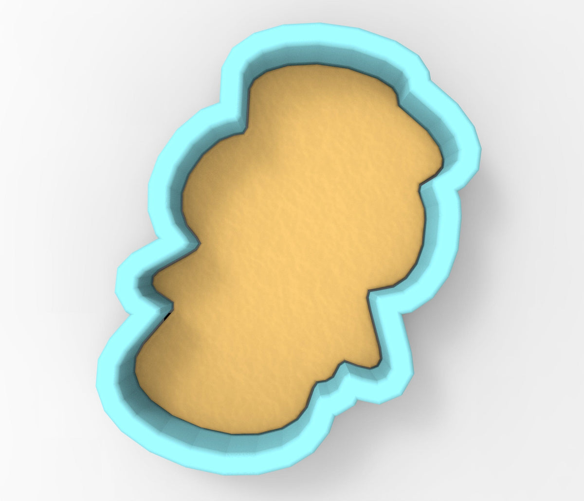 A blue-bordered cookie cutter in the shape of a cartoon character.