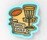 A 3D cookie cutter in the shape of a disc golf basket with a frisbee above it, and a banner that says "DISC GOLF" below.
