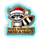 a raccoon wearing a santa hat and holding a sign that says does someone