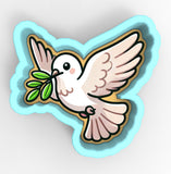 a white bird with a green leaf in its beak