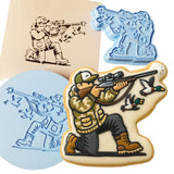 a cookie with a picture of a man shooting a gun