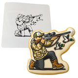 a cookie with a picture of a soldier shooting a gun