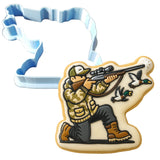 a cookie cutter with a picture of a man shooting a bird