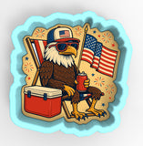 an eagle with a hat, sunglasses, a flag and a cooler