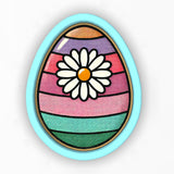 an egg with a flower painted on it