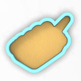 a cookie cutter with a cookie in the shape of a cookie